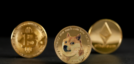 A picture of Bitcoin, Dogecoin and Ethereum coins