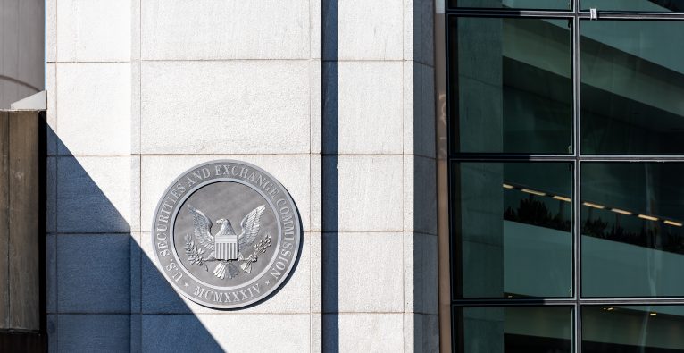 Washington DC, USA - October 12, 2018: US United States Securities and Exchange Commission SEC entrance architecture modern building closeup sign, logo, glass windows